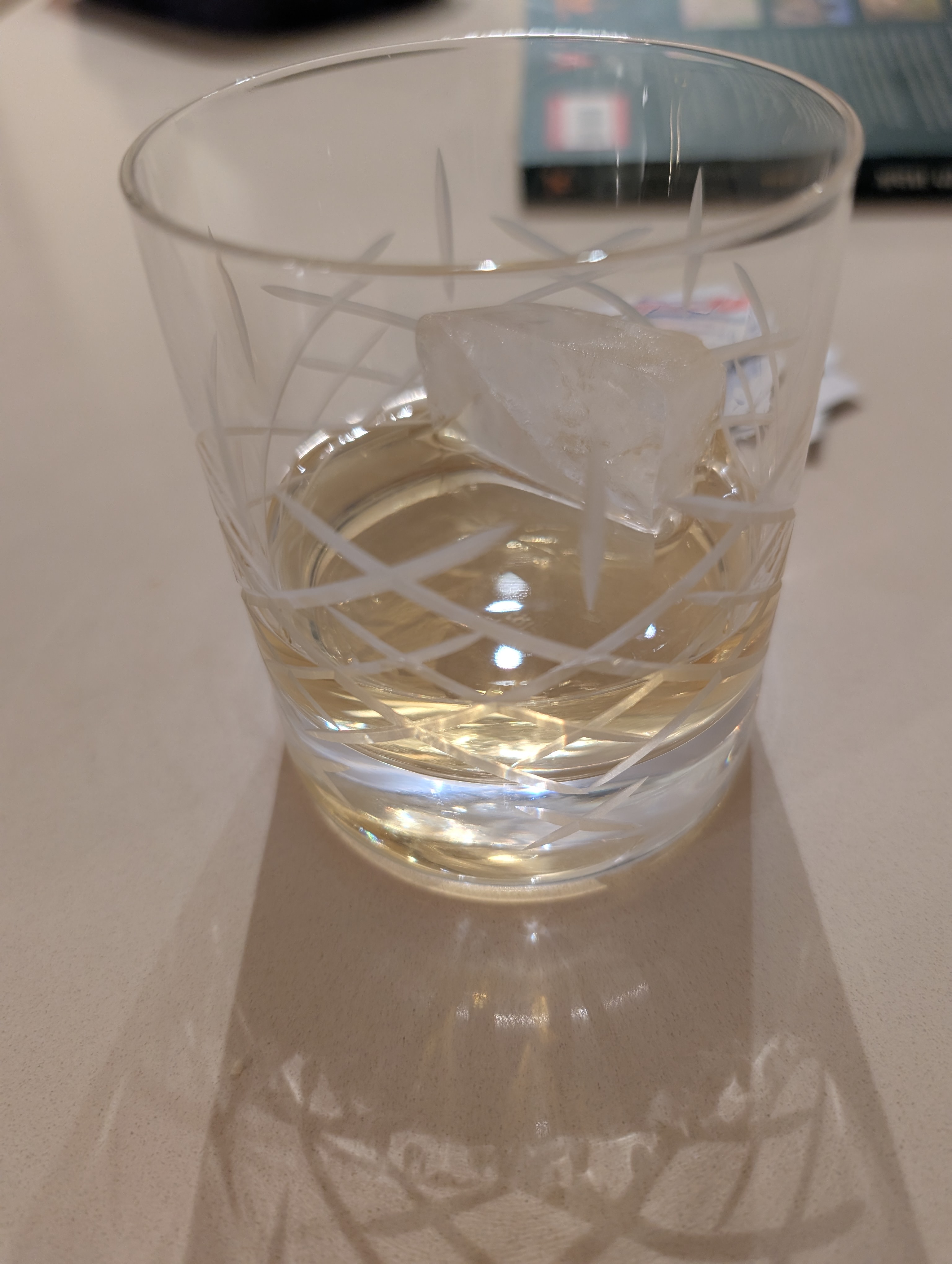 Photo of the whisky in a glass with ice
