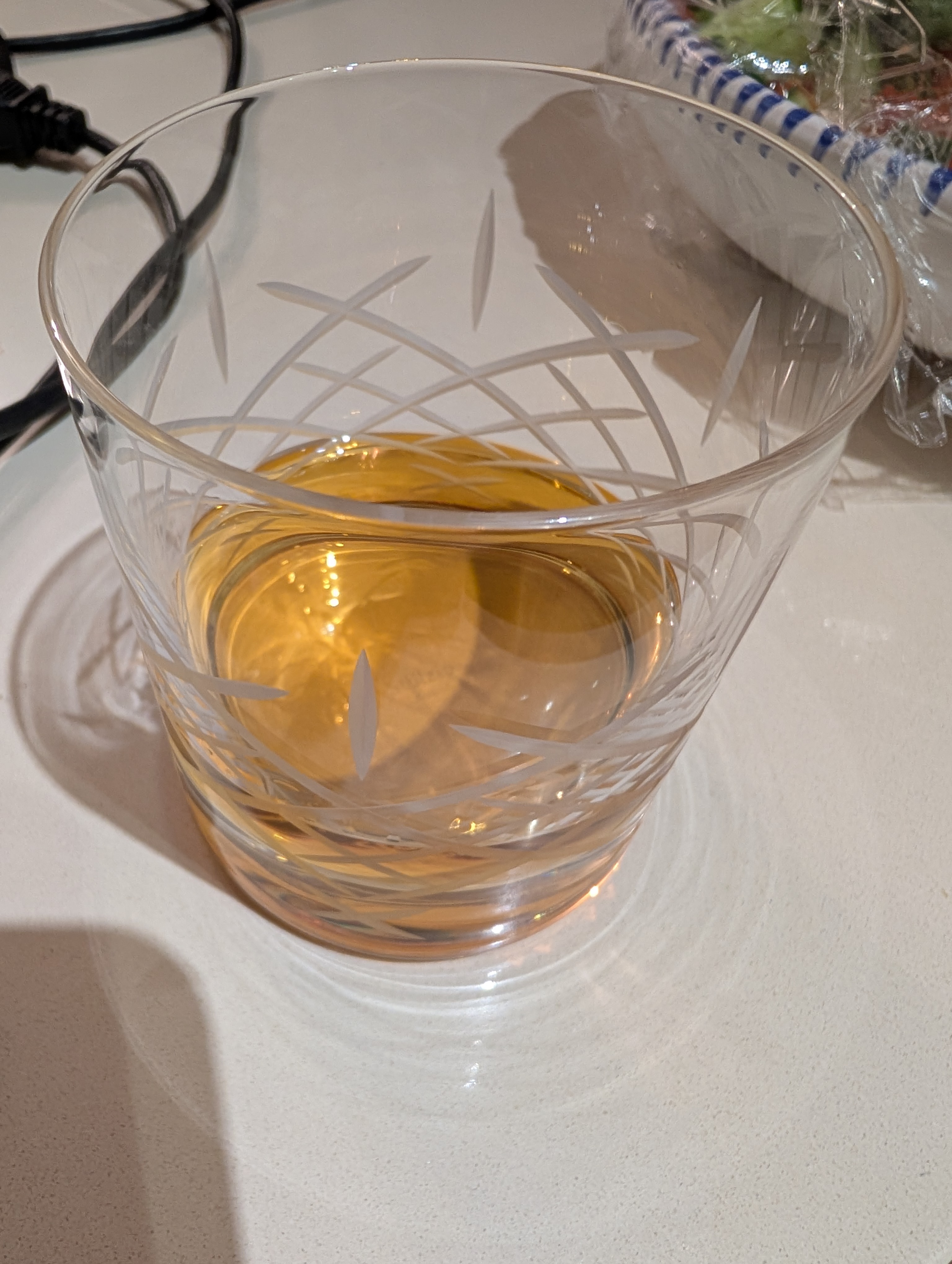 Photo of the whisky in a glass with ice